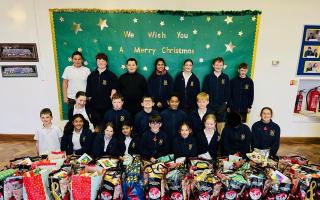 Pupils at How Wood Primary School with the gift bags
